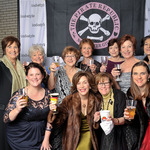  Caption: To the moon: Brigands Ladies in Waiting taost the memory of longtime red-coated security chief Larry Moon, who passed away a few weeks before the ball.  /   Credits: Photo by Robin May